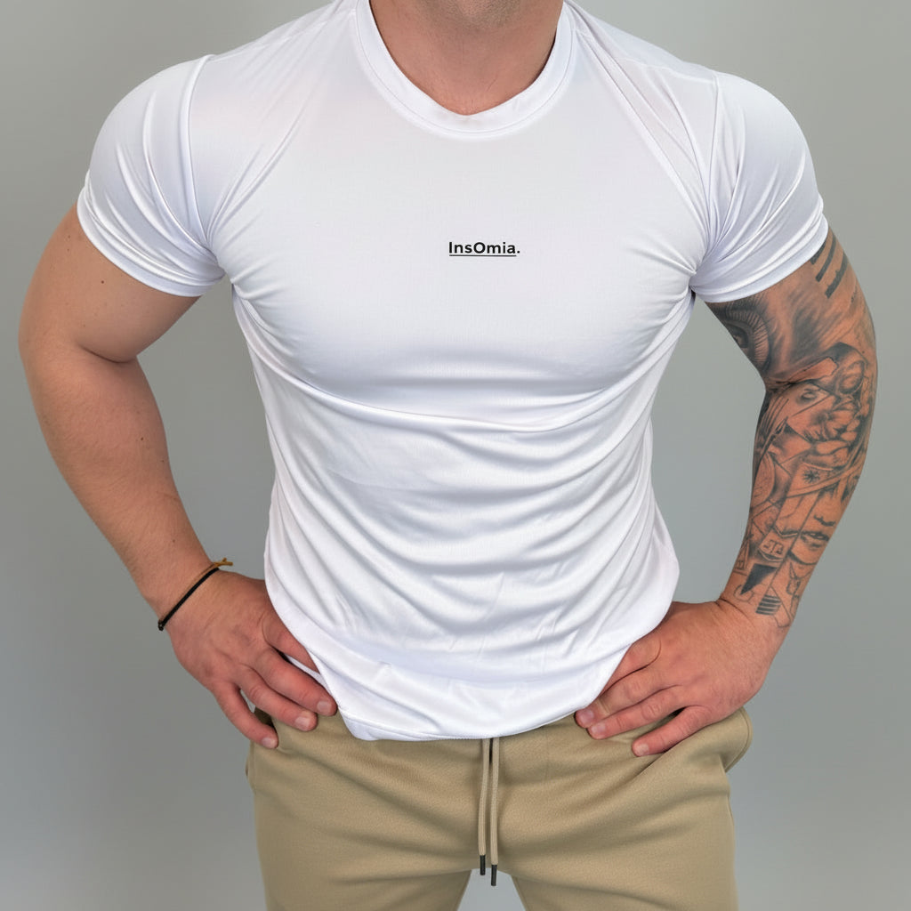Person wearing a white t-shirt with 'Insomnia' branding against a plain background