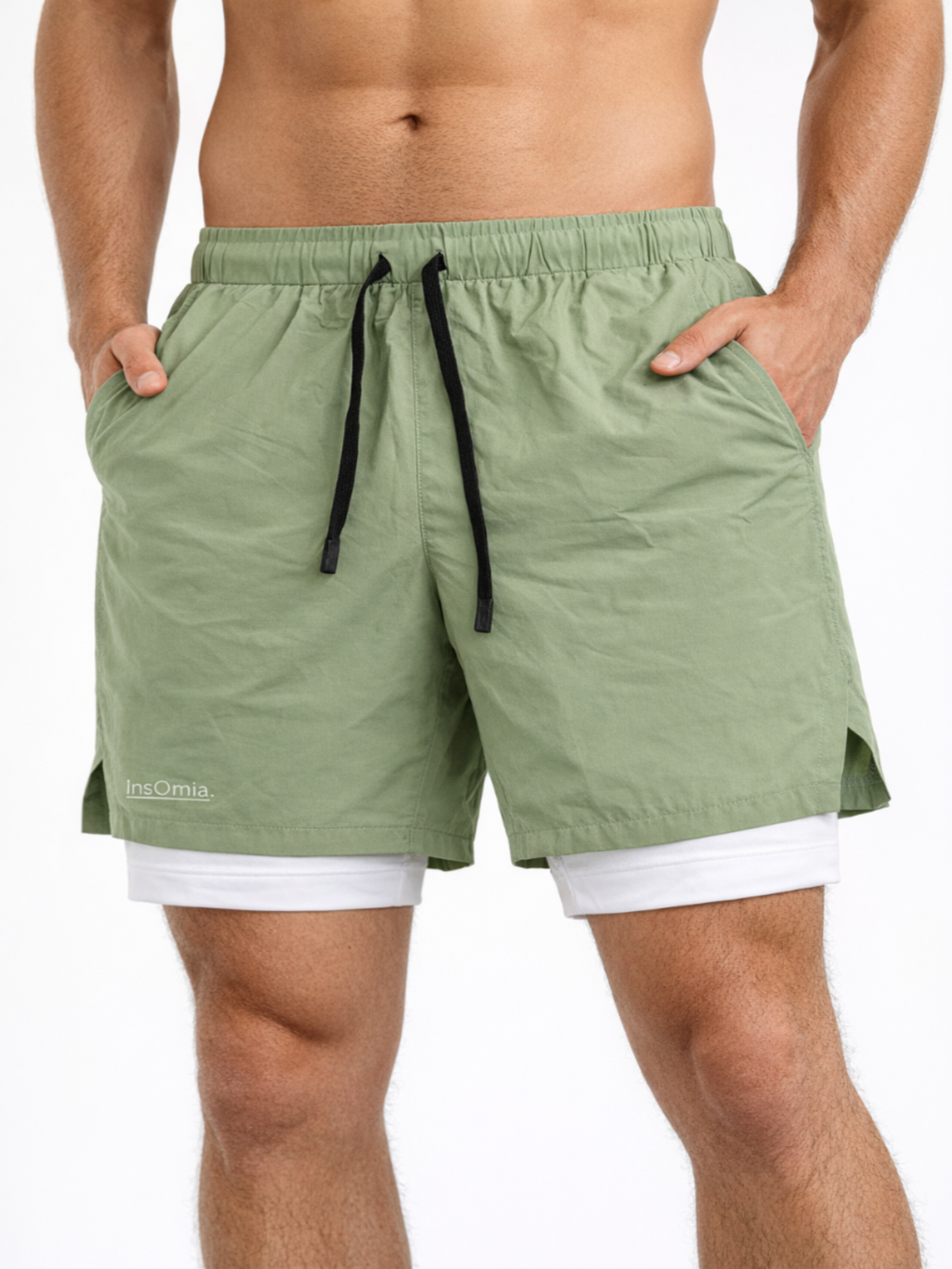 Green shorts with a white label on a plain background